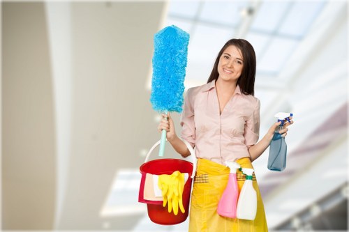 Cleaning technician treating a carpet stain with specialist equipment